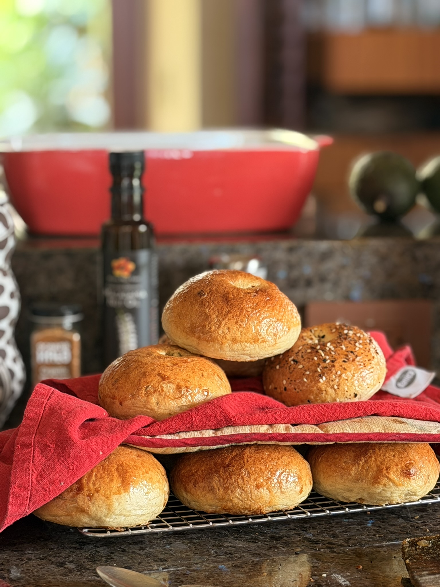 Fresh sourdough bagels on a cooling rack